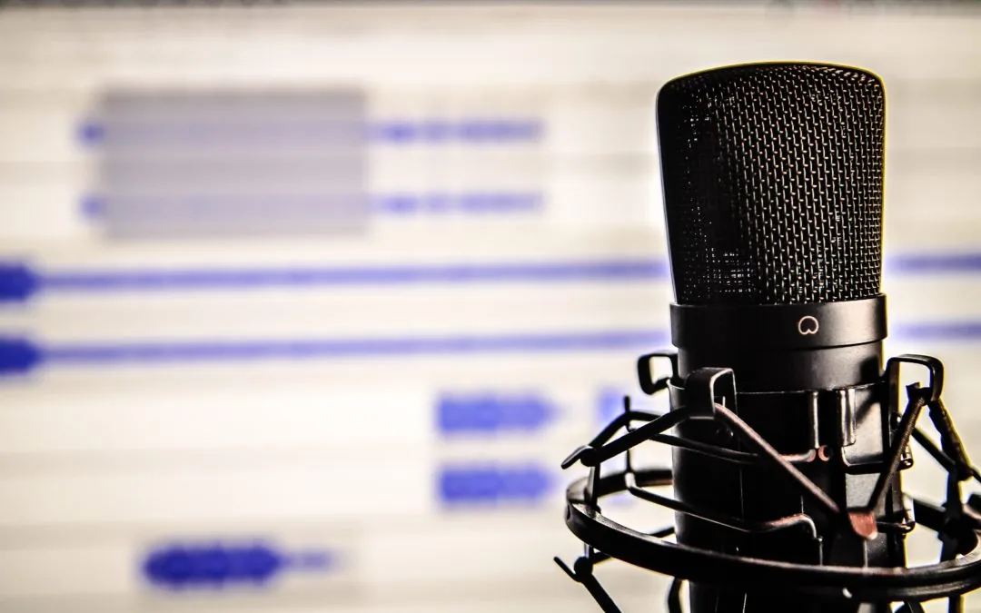 A close-up of a podcast microphone