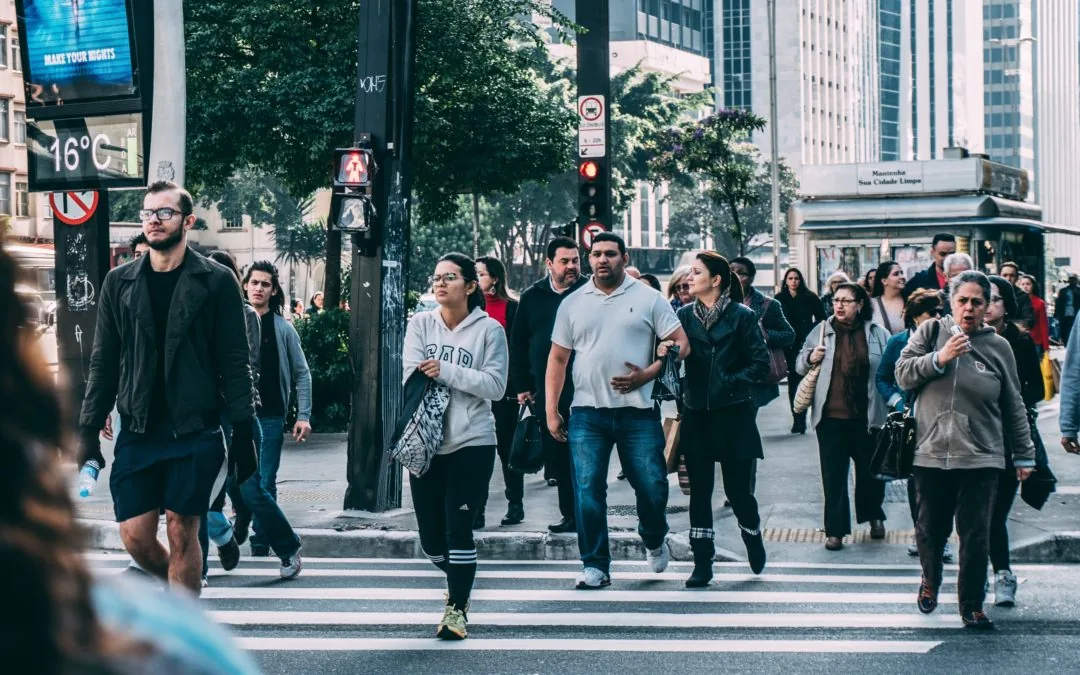 A busy crosswalk full of people